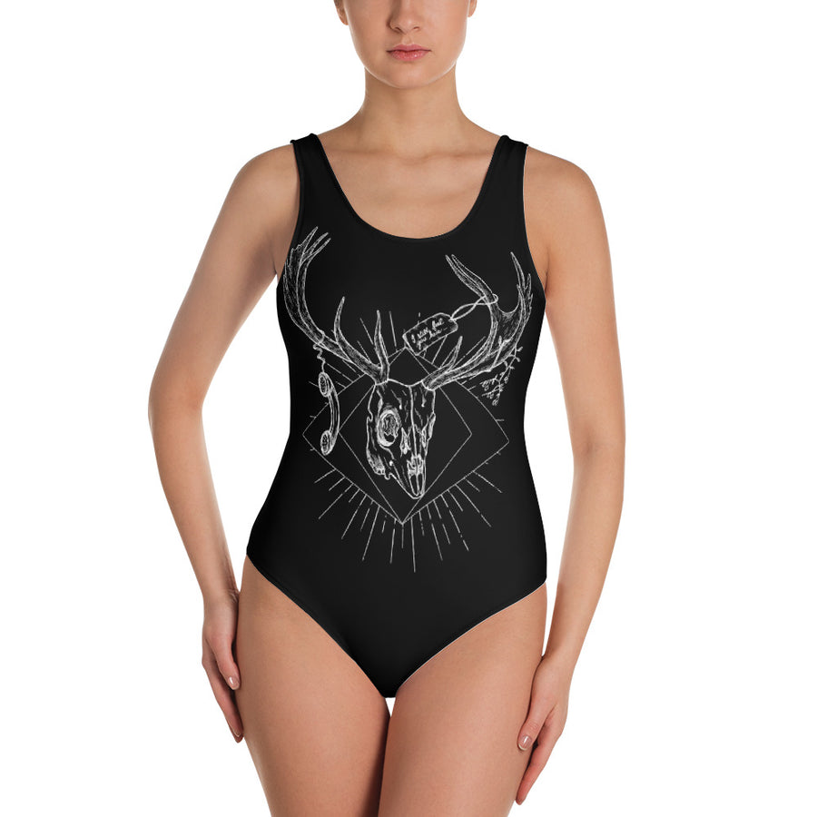 black full piece swimsuit with a white design on it 